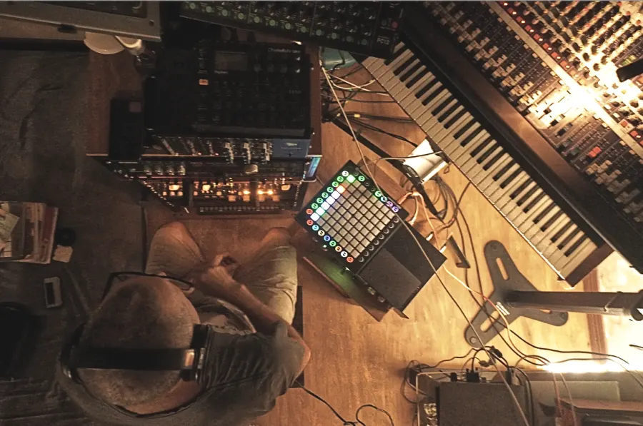 Studio collaborator working at a panoramic workstation inside Dosel